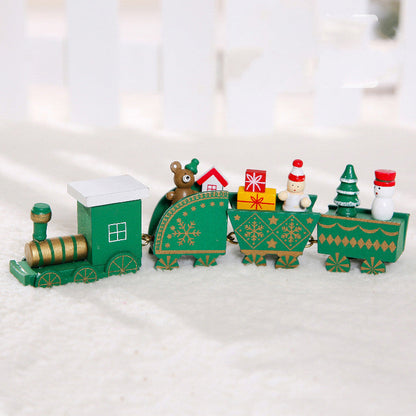 Wooden Christmas train decoration with festive red and green detailsburugburu