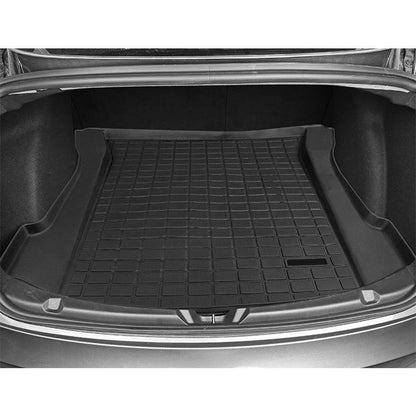 Black TPE trunk pad for vehicle cargo area, shown from above