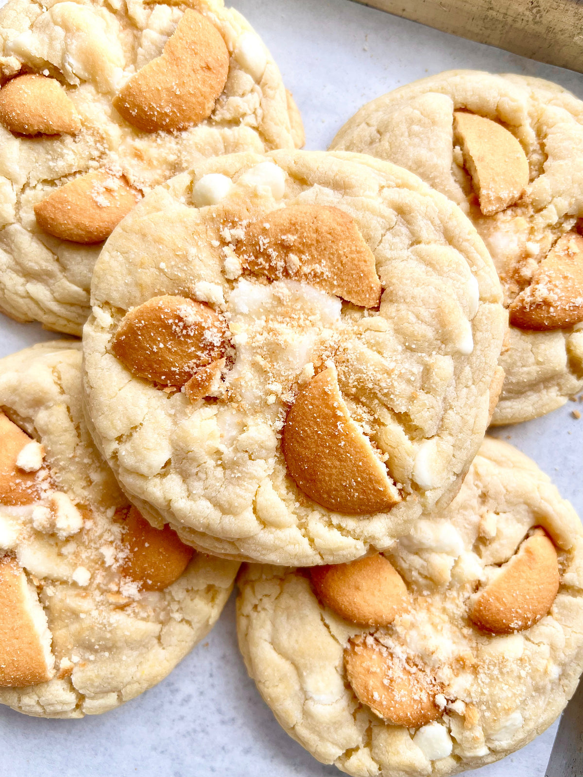 Cookies from Let's Get Baked Artisan Desserts featuring banana pudding flavor, arranged in a decorative display.