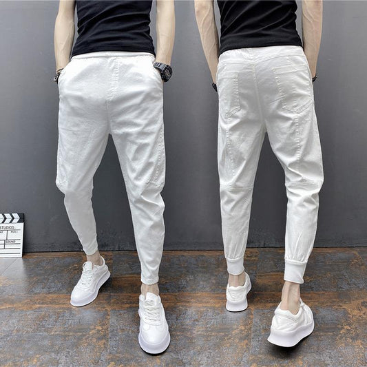 Slim-fitting ankle-length solid color harem pants with elastic ankle ties and tapered fit