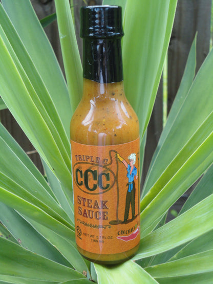 Cinderosa Ranch Triple C Steak Sauce hot sauce bottle with label, featuring bold red and black design and spicy sauce inside.