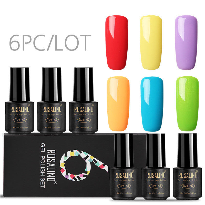 Six bottles of Fine nail polish in assorted colors displayed together