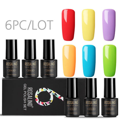Six bottles of Fine nail polish in assorted colors displayed together