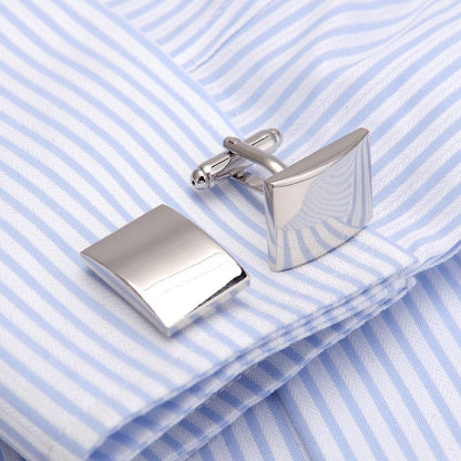 Plain glossy French Western-style cufflinks close-up, featuring a polished silver-tone design