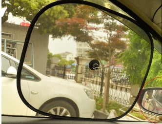 Car sunshade sunscreen displayed for windshield protection, black design with reflective surface