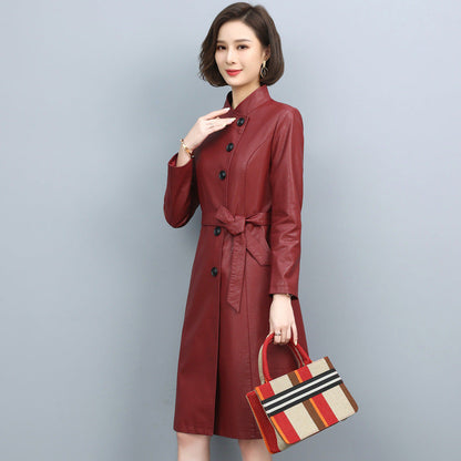Women's leather trench coat with turn-down collar, drawstring waist, and long loose silhouette in solid color
