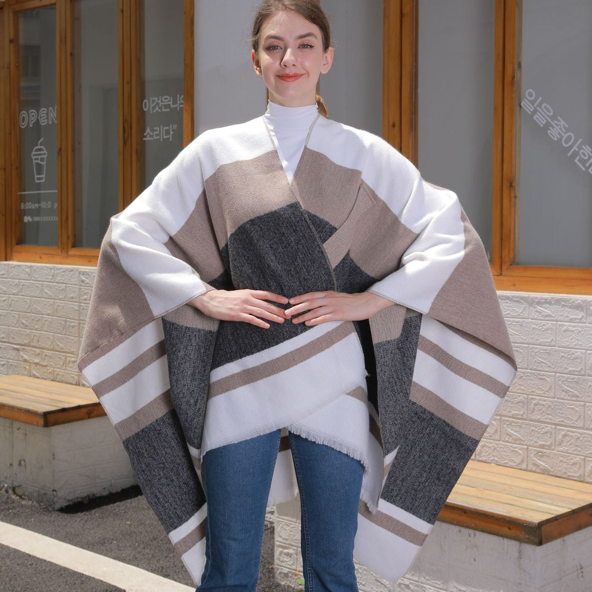 Women's striped tassel cross-strap warm cape shawl draped over shoulders