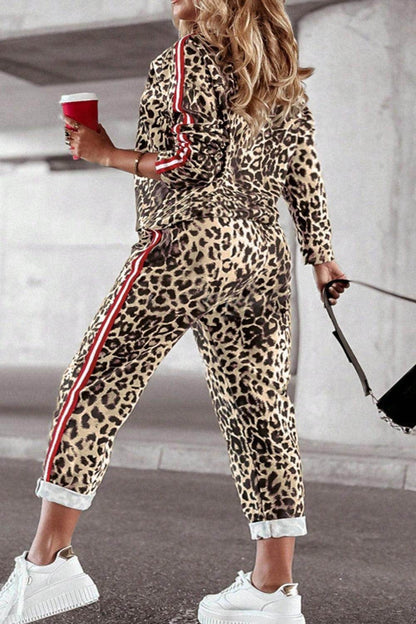 Plus size leopard print round neck top and pants set for women, featuring trendy casual style and comfortable fit.