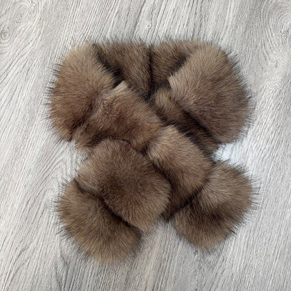 Segmented wool patches and plush materials cross-knitted into a mature, elegant coat with fur detail