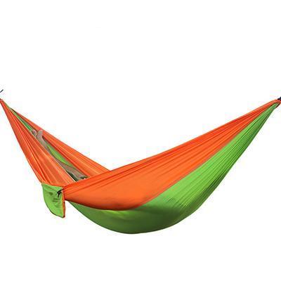 Portable nylon parachute backpacking double hammock suspended outdoors