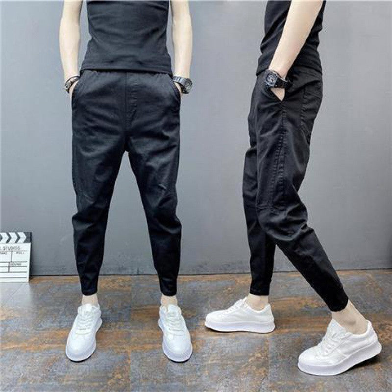Slim-fitting ankle-length solid color elastic ankle-tied harem trousers lounging on display