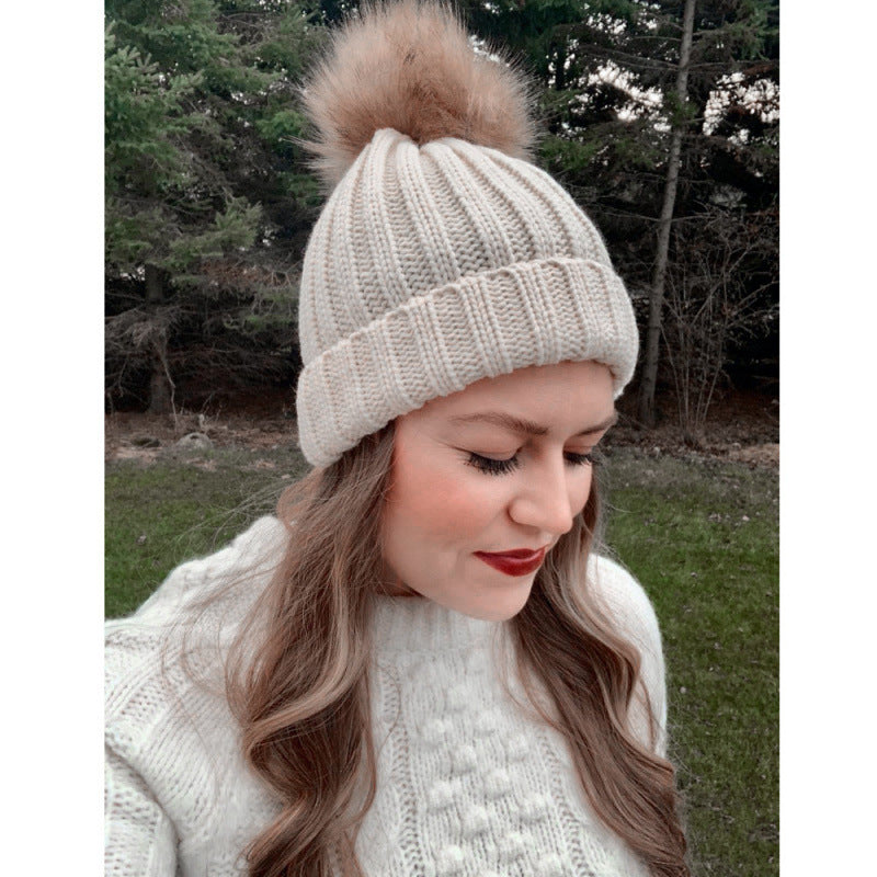 Women's solid-color brimmed hat with satin pom-pom, front view