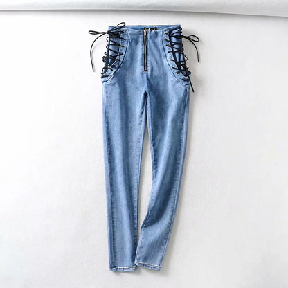BackupMyFilesNow® chic high waist denim jeans hanging on a wooden rack, showcasing stylish blue denim with a high-rise fit.