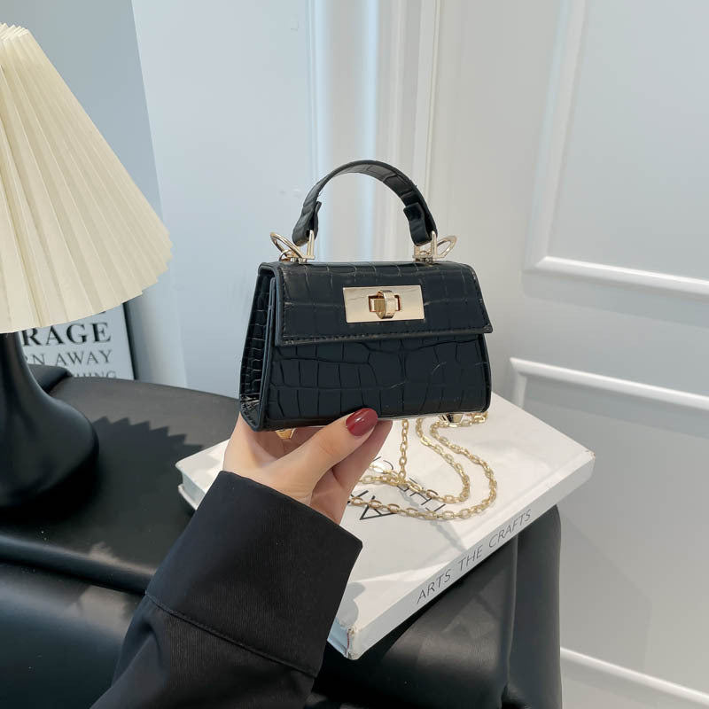 Casual small square handbag with shoulder strap in a compact design