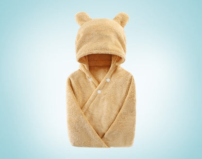 Cotton baby care hooded bath towel with soft hood and absorbent fabric folded neatly