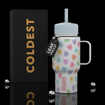 Coldest 6.7oz bottle with colorful candy hearts design, featuring a vibrant and playful pattern on the bottle's surface.