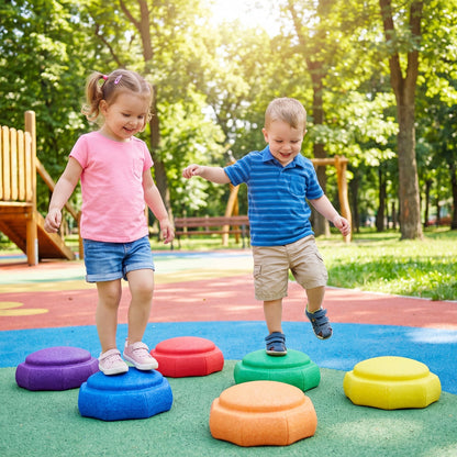Six colorful plastic stepping stones for kids balance training, arranged in a semi-circle on a grassy surface.