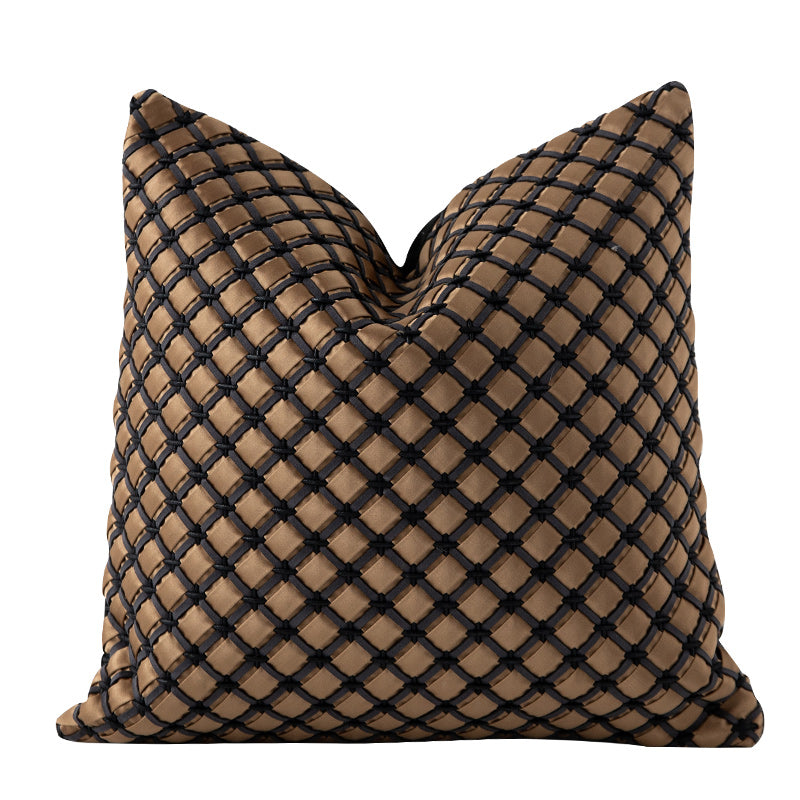Woven throw pillows arranged on a sofa in a living room