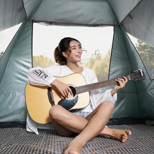 Automatic outdoor camping barbecue tent setup, showing a portable shelter and cooking area by the campsite