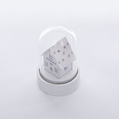 Luminous wooden house Christmas ornament with festive holiday design and glowing windows