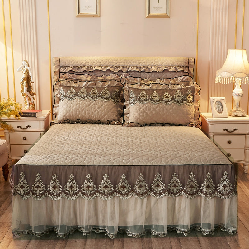 Quilted lace bed skirt bed liner in a soft, textured design draped around the mattress sides