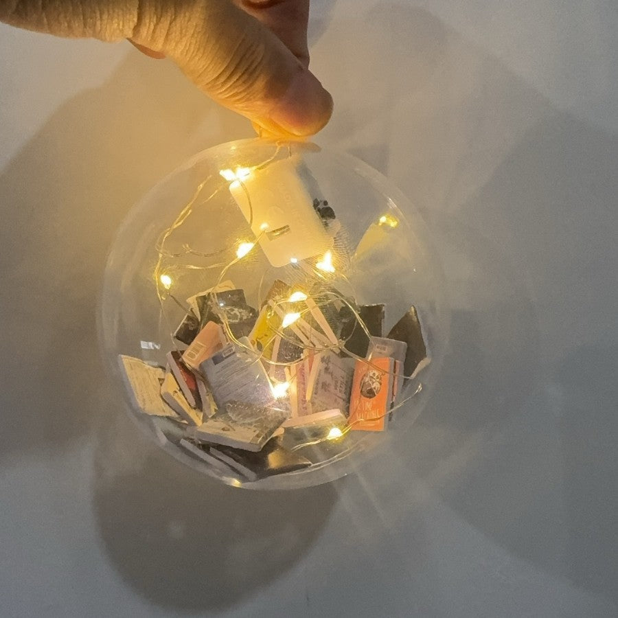 Christmas decorations featuring book-filled Christmas ball pendants in festive ornament design