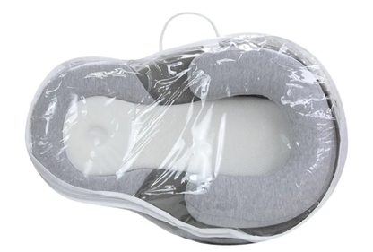 Baby anti-spit up pillow by BACKUPMYFILESNOW® with soft fabric and contoured shape for comfortable feeding and reflux support.