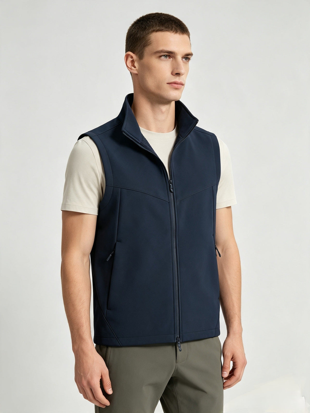 Men and women’s softshell vest with stand collar, zip front, fleece lining, and sleeveless outdoor design