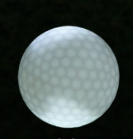 Flashing LED golf ball for nighttime play, glowing golf supply close-up