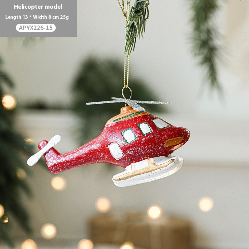 Painted plastic Christmas tree pendant decoration in festive holiday design