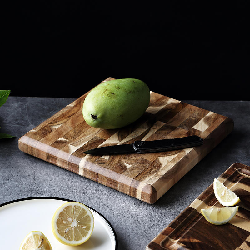 Solid wood parquet cutting board for kitchen household food preparation, featuring a natural wood pattern