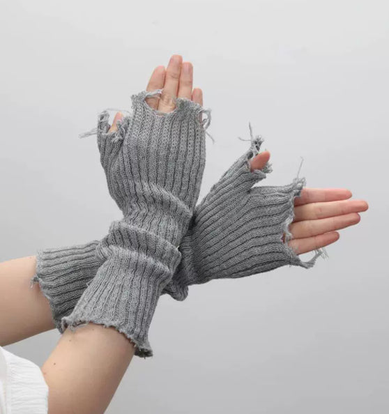 Black tattered punk unisex fingerless cuff knit gloves, pair of edgy hand warmers displayed together