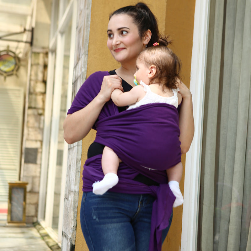 Solid color baby sling carrier in a simple, adjustable design for comfortable infant carrying