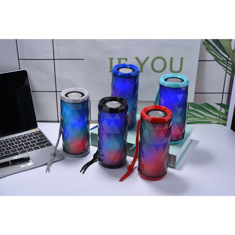Portable Bluetooth outdoor speaker with card slot and subwoofer, compact black design