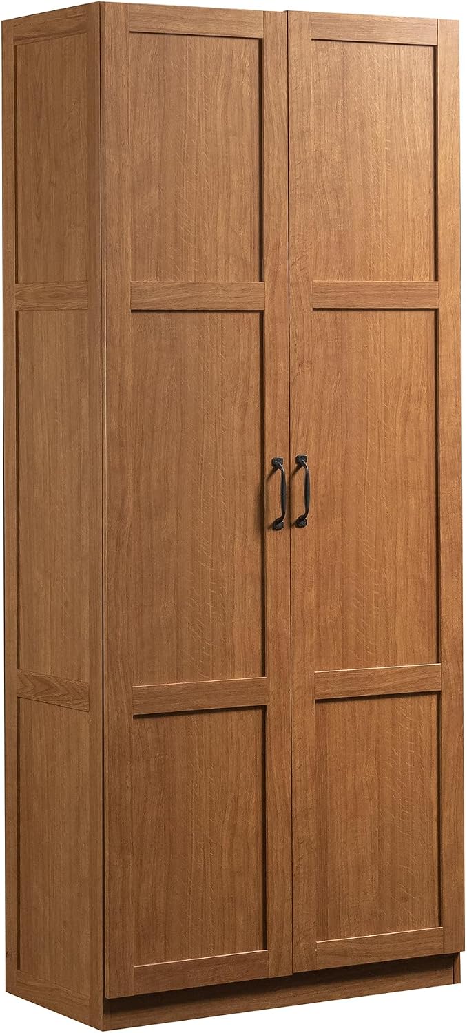 Sauder Select white storage cabinet with multiple pantry shelves, ideal for organizing snacks and kitchen essentials.