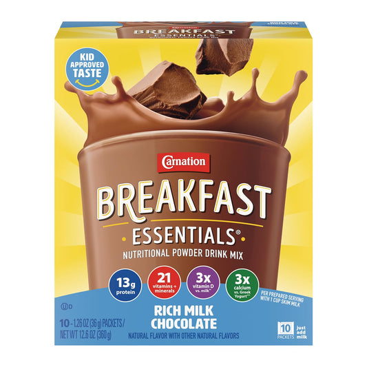 Carnation Breakfast Essentials strawberry nutritional drink mix in a glass with a spoon, ready to enjoy as a complete breakfast.