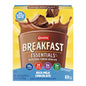 Carnation Breakfast Essentials strawberry nutritional drink mix in a glass with a spoon, ready to enjoy as a complete breakfast.