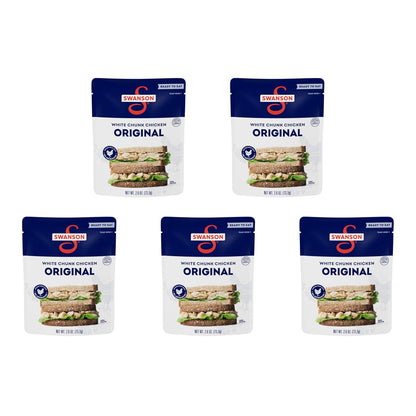 Canned Swanson White Premium Chunk Chicken in Water, 4 cans of 2.4 oz each, showing the product label and cans stacked together.