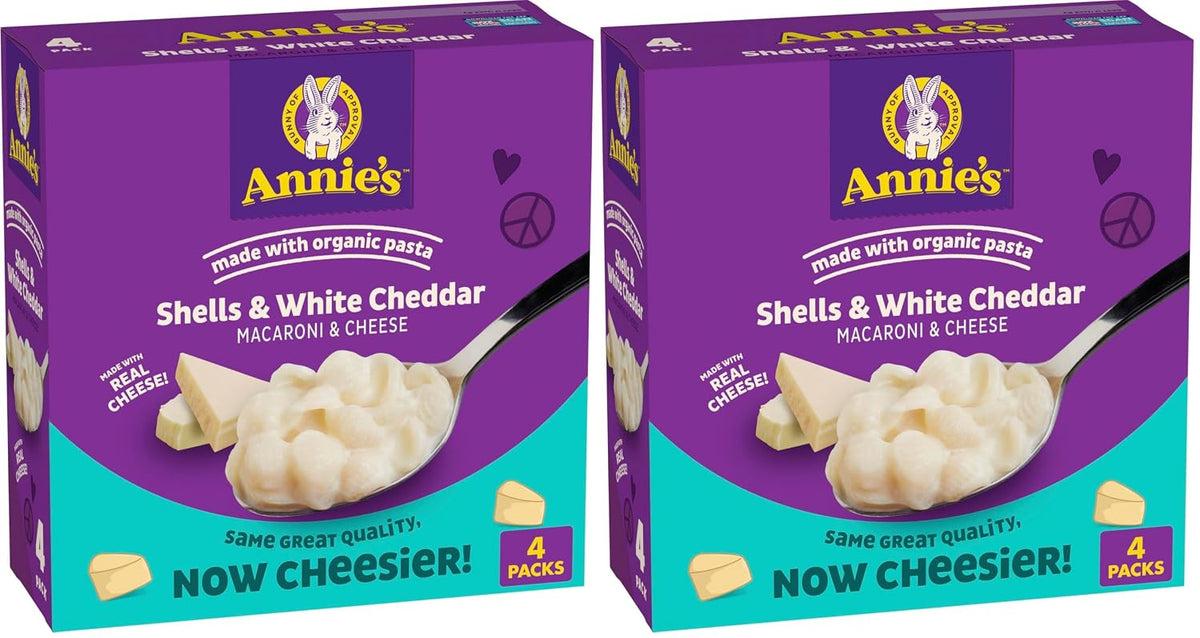 Annie's Homegrown organic shells and white cheddar mac and cheese pack with four 24 oz boxes on a white background.