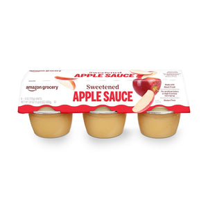 Six Amazon Grocery unsweetened apple sauce cups in 4 oz packaging, featuring natural apple flavor in portable cups