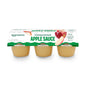 Six Amazon Grocery unsweetened apple sauce cups, 4 oz each, with clear labels and fruit illustrations on the packaging.