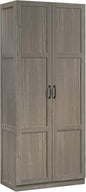 Sauder white storage cabinet with pantry and snack chip variety display in a modern kitchen setting