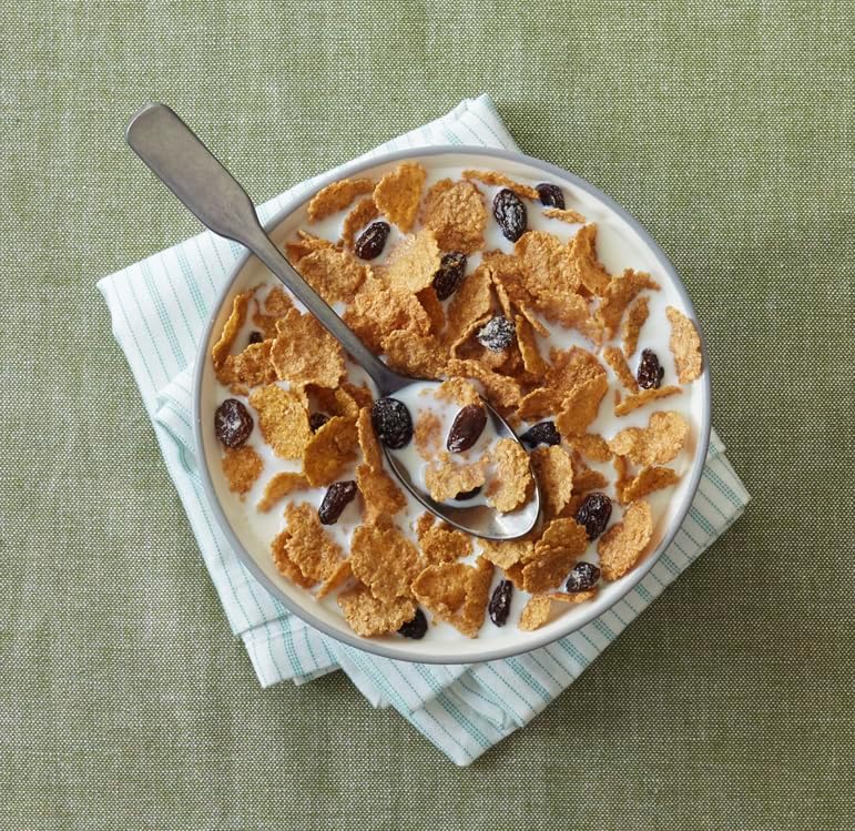 Post Raisin Bran cereal box featuring whole grain wheat, bran, and raisins in a 16.6 oz box.