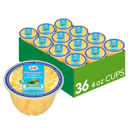 Canned Dole pineapple tidbits and tropical fruit in 4 oz bowls, 12-pack, showing colorful fruit pieces in syrup.