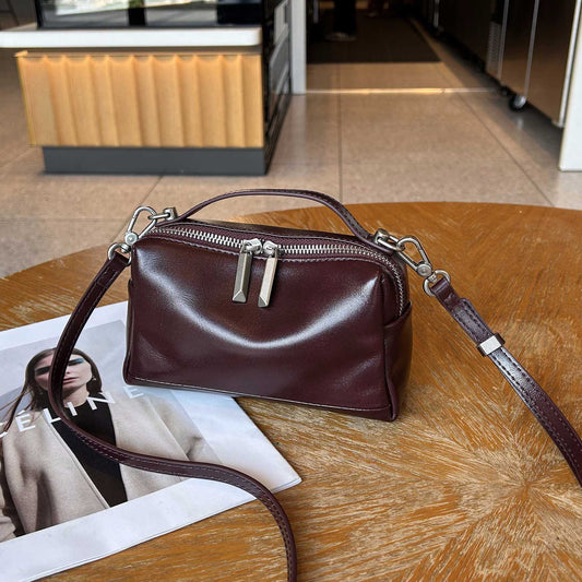 Top-grain vegetable-tanned leather small square crossbody bag with single shoulder strap and compact phone pouch