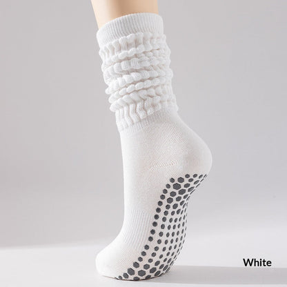 Women's silicone non-slip yoga socks in black with grippy soles
