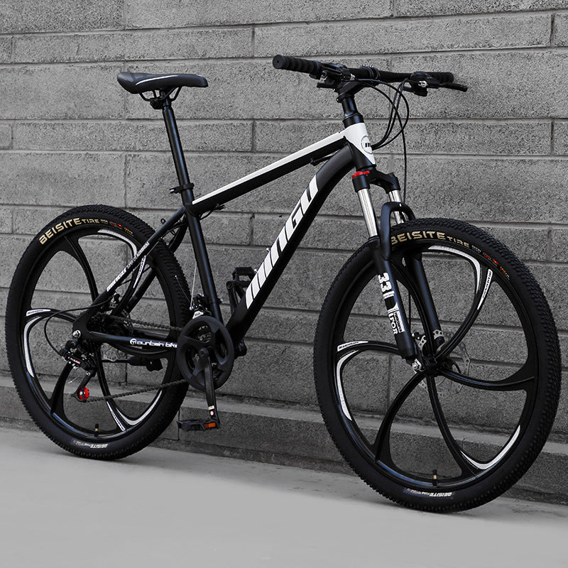 Mountain bike bicycle with disc brakes, shock absorption, and variable-speed gearing in 24 or 26 inch size