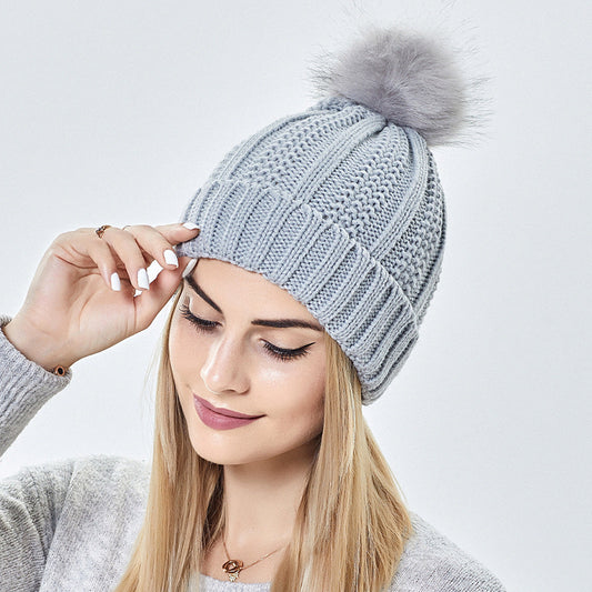 Women's winter knitted beanie hat with faux fur pom pom, stretchy lined skull cap for warmth