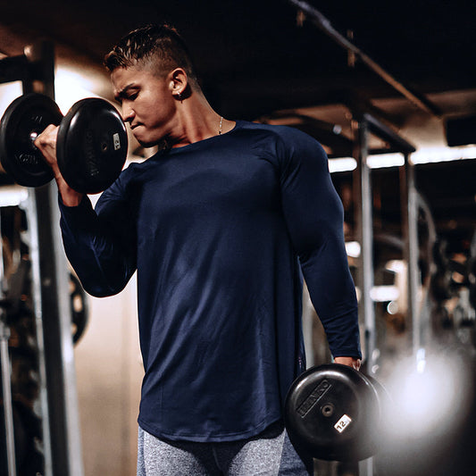 Back view of black long sleeve sports T-shirt with vertical lettering for fitness training