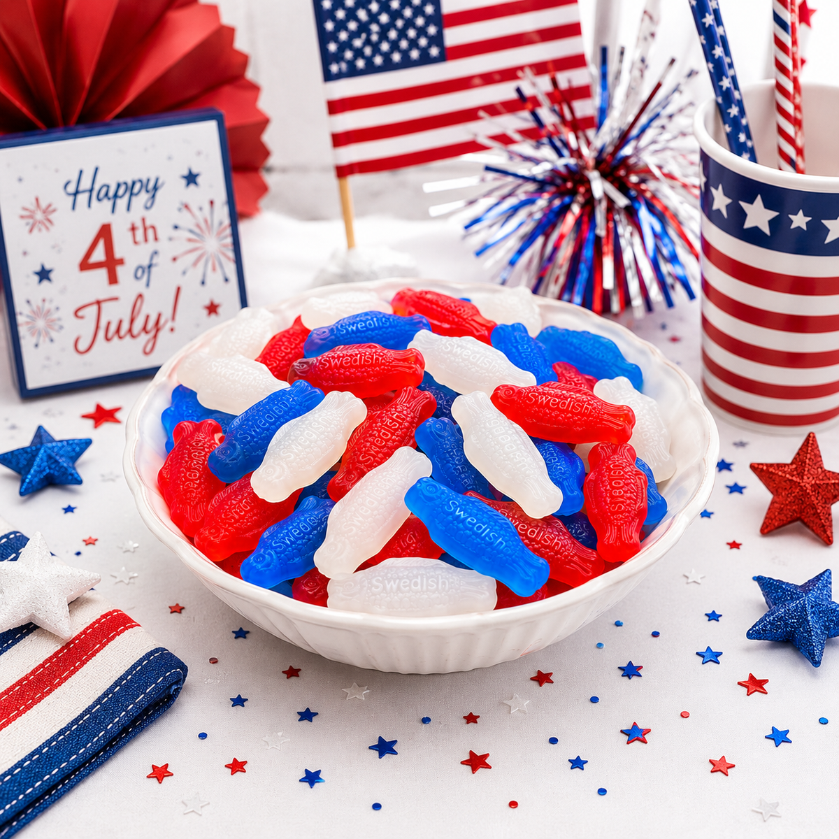 Red, white, and blue Swedish Fish Mini candies from Candy In Bulk in a large value bag, featuring colorful gummy fish.